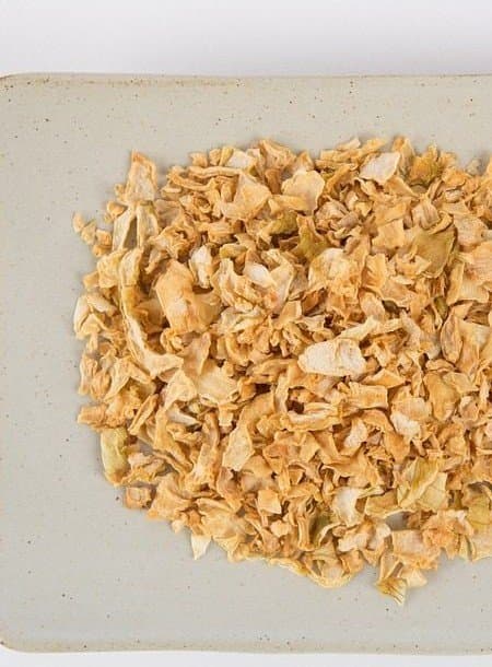 Dehydrated onion flakes on a plate